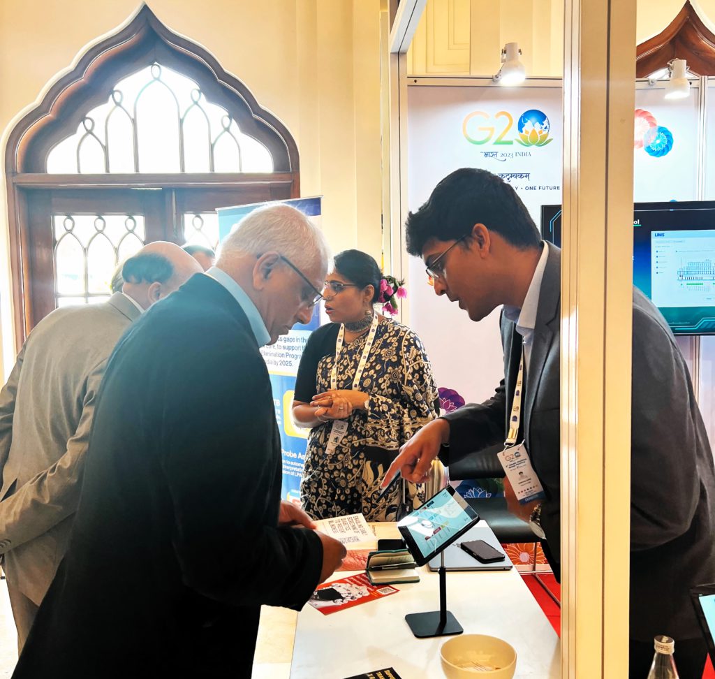 Wadhwani AI team member demonstrating our ophthalmology AI solution that screens for diabetic retinopathy at G20 event
